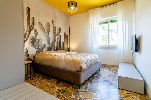 En eller flere senge i et værelse på Casalicia Acireale