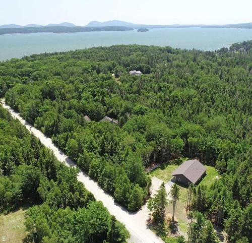 an aerial view of a house in the middle of a forest at Newly Built Retreat in the Woods Near Acadia in Trenton