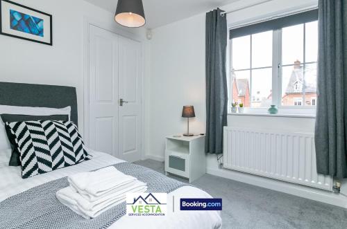 a white bedroom with a bed and a window at Three Bedroom Apartment By Vesta Serviced Accommodation & Short Lets Hatfield With Free Parking in Hatfield