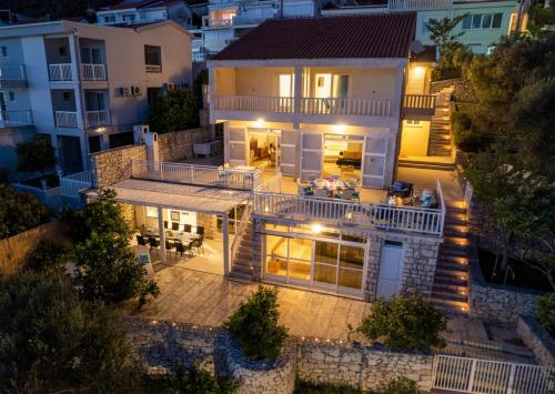 an aerial view of a house at night at Villa Azzurro with Private Beach in Neum