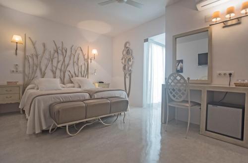 Postel nebo postele na pokoji v ubytování Hotel Sa Volta