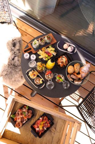 a table with a bunch of food on it at Agrad Chalets in Aschau im Chiemgau
