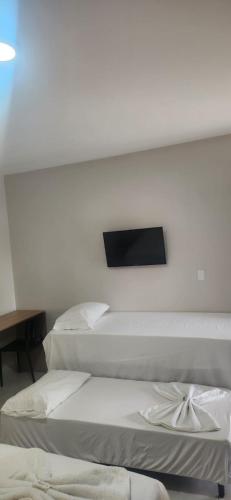 Katil atau katil-katil dalam bilik di Hotel Aroma's Suítes