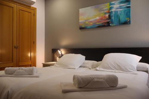 Postel nebo postele na pokoji v ubytování Hotel Tierra de Garnacha