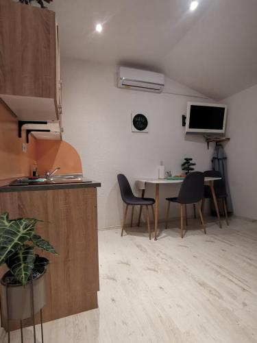 Телевизор и/или развлекательный центр в Haus Cataleya