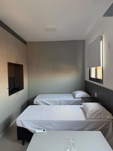 Ένα ή περισσότερα κρεβάτια σε δωμάτιο στο Apartamento Completo com Piscina, Academia e Salão de festas em São Carlos