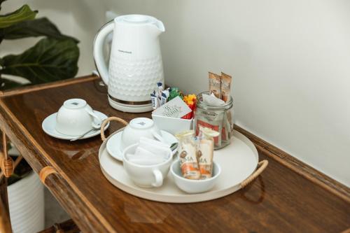 a table with a tea set on top of it at 55 Tulbagh events and wedding venue in Kempton Park