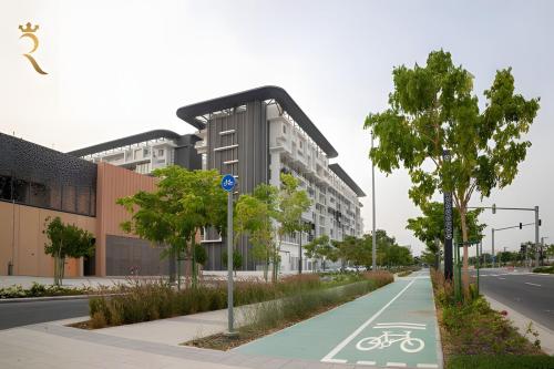a rendering of a bike path in front of a building at Oasis Luxe 1BR - Stylish Luxury Stay Near Masdar Park & City Centre Masdar in Abu Dhabi