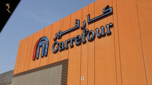 a sign on the side of a car dealership at Oasis Luxe 1BR - Stylish Luxury Stay Near Masdar Park & City Centre Masdar in Abu Dhabi