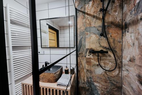 a bathroom with a sink and a mirror at Valdštejn - pohoda v Českém ráji in Jičín