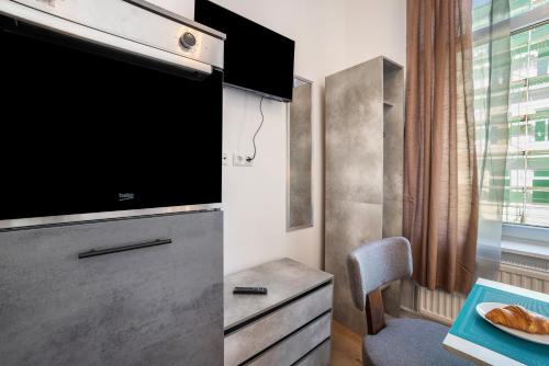 a living room with a large flat screen tv at Altstadt Residenz in Lübeck