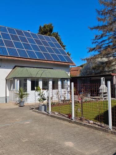 a house with a lot of solar panels on the roof at Bei s' Herrs in Rheinmunster