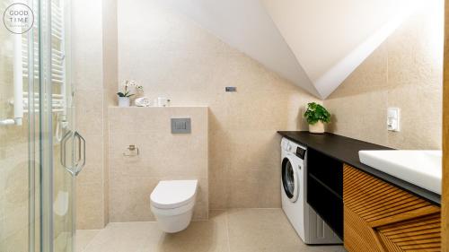 a bathroom with a toilet and a sink at Apartamenty Good Time - Belle View - Centrum in Szklarska Poręba