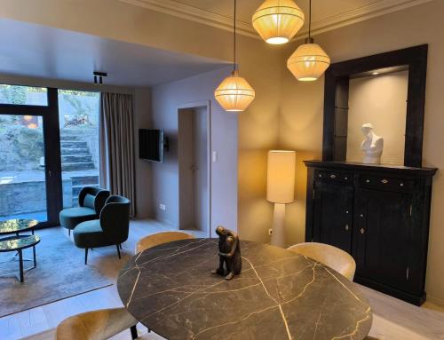 Χώρος καθιστικού στο Le 76 appartement 2 chambres avec jardin