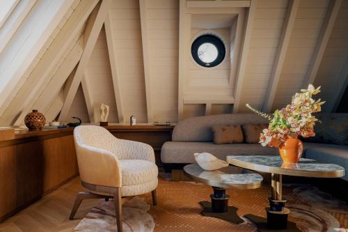 a living room with a couch and a table at Villa Pétrusse in Luxembourg