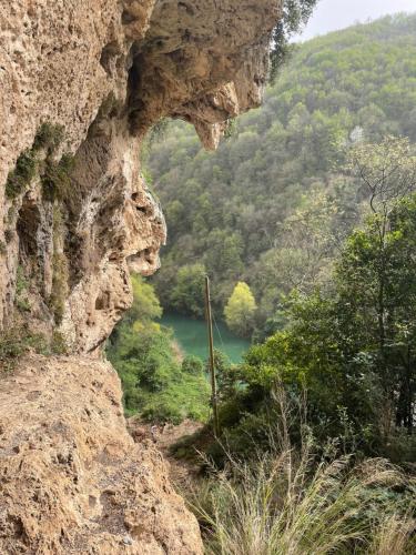 a view of a river from a rock cliff at casa cappellino in Vicovaro