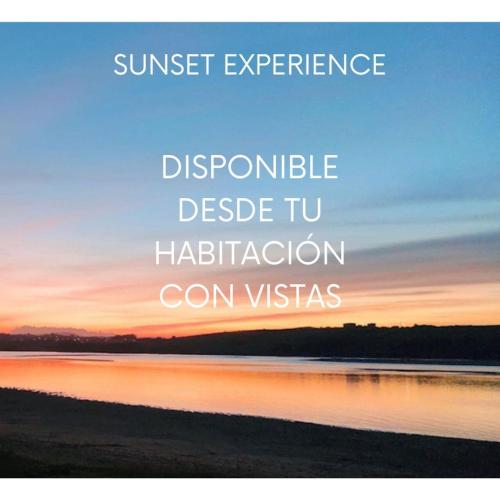 a sunset over a lake with the wordssunset experience dopamine dissolve tuhabitation at Hotel Milagros Golf in Mogro