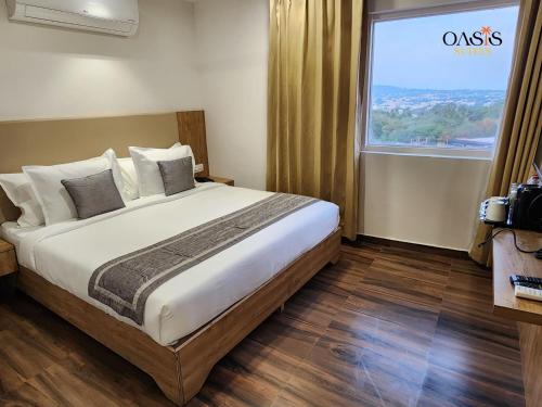 Oasis Suitesにあるベッド