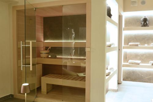 a bathroom with a glass shower and a sink at Suite Hotel Santa Chiara in Lecce