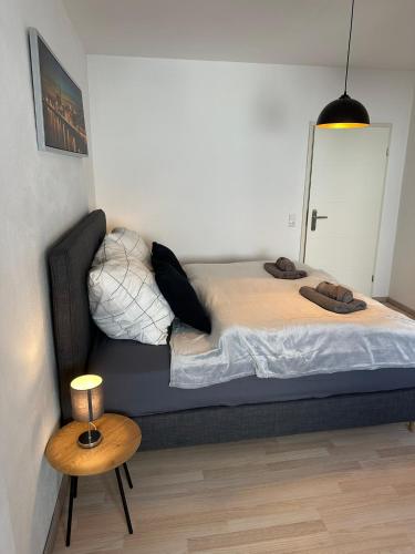 a large bed in a room with a table at Yellow one in Magdeburg