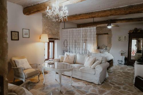 a living room with a couch and a table at Ewas Cretan Vintage Houses- Pet Friendly in Kharkhalianá