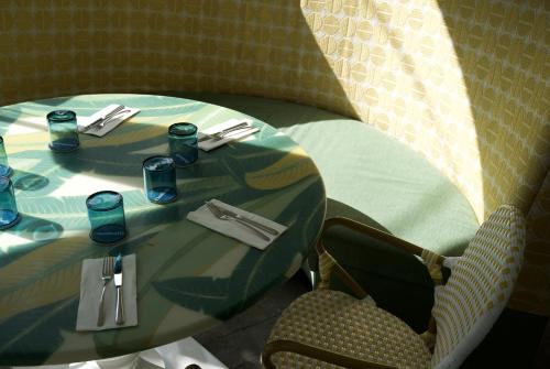 a table in a restaurant with a table and chairs at Rosedon - Adults Only from Jan 2025 in Hamilton
