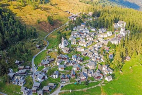 an aerial view of a small village in the mountains at Rustico Al Museo Bosco Gurin - Happy Rentals in Bosco Gurin