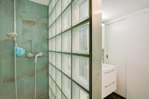 a bathroom with a shower and a glass door at Rustico Al Museo Bosco Gurin - Happy Rentals in Bosco Gurin