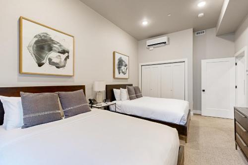 a bedroom with two beds and a tv at 304 - Black Rock Mountain Resort in Heber City