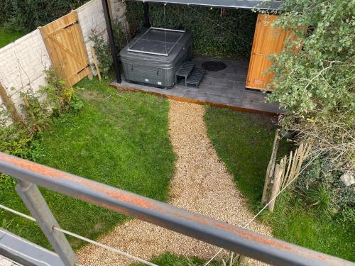 an overhead view of a backyard with a grill in the grass at Loft du presbytère - Calme et nature in Beauraing