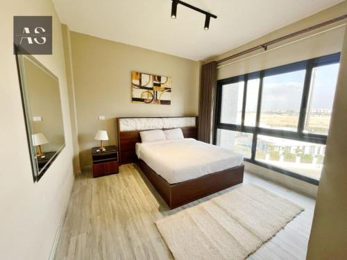 Katil atau katil-katil dalam bilik di Alshemy Serviced Apartments