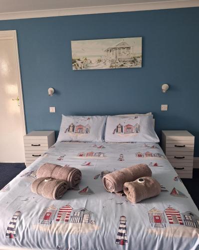 a bed with pillows on it in a bedroom at Ensuite Double Room with Countryside Views in Cranleigh