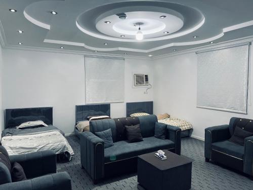 Ruang duduk di شقة النخيل المخدومة - Palm Hotel Apartments