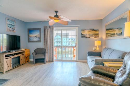 a living room with a couch and a ceiling fan at Sea Pond Villa Unit 3 in Myrtle Beach