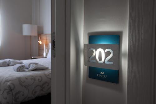 Letto o letti in una camera di Oneira Rooms