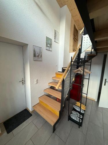 a staircase in a house with a stair case at Bed&Cheese Deggio in Quinto