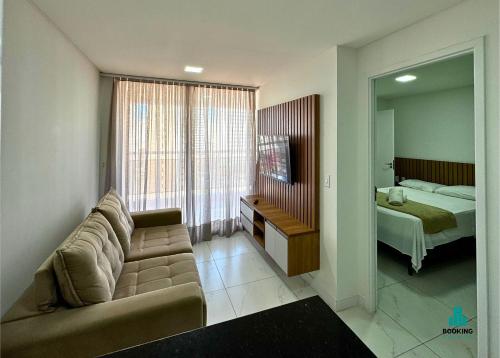 a living room with a couch and a bed at Aquarius Residence by Holiday Stays in Fortaleza