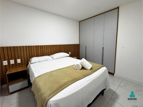 a bedroom with a large white bed in it at Aquarius Residence by Holiday Stays in Fortaleza