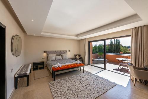 a living room with a couch and a table at Villa Anna - Havre de paix in Oulad Ikhia