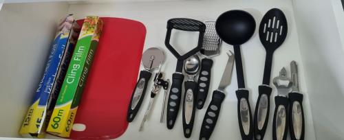 a group of kitchen utensils sitting on a counter at -RE15CFA- For Relaxed and Cosy stay with Free Parking in Leeds
