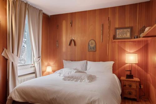 Ένα ή περισσότερα κρεβάτια σε δωμάτιο στο Maison Alessia Courmayeur