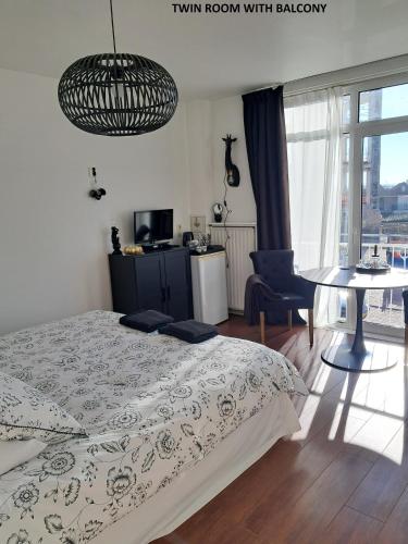 Postel nebo postele na pokoji v ubytování El Sol Zandvoort 2
