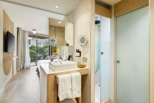 a bathroom with a sink and a shower at Barceló Illetas Albatros - Adults Only in Illetas