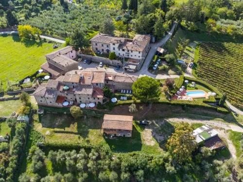 an aerial view of a large house with a yard at FATTORIA L'OTTAVO l'8 LARGE WINE AND OIL PRODUCERS in Lucolena in Chianti