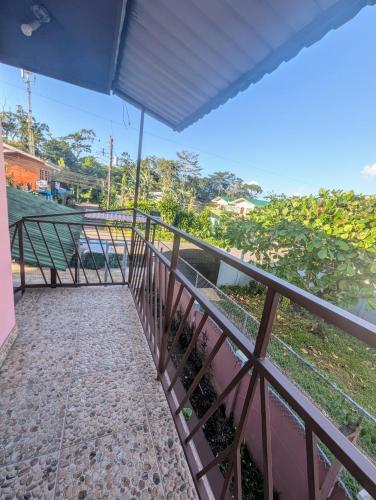 a balcony of a house with a fence at Departamento Ángeles del Arenal #1 in Fortuna