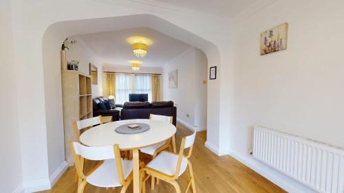 a living room with a table and chairs and a couch at Rewley Road in Oxford