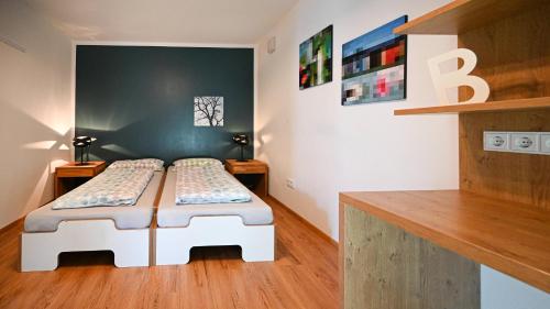 a room with a bed with two twin beds in it at Apartment mit überdachter Terrasse 7 7 EG in Friedrichshafen