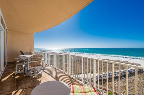 a balcony with a view of the beach at Phoenix Orange Beach II 603 condo in Orange Beach