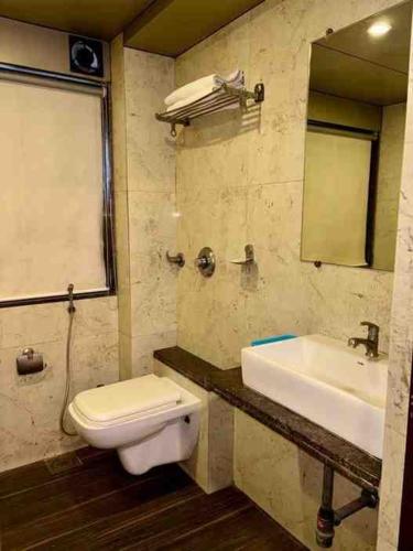 Ein Badezimmer in der Unterkunft Hotel Sai Residency