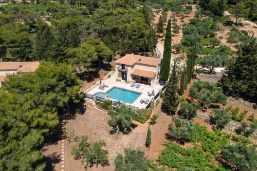 an overhead view of a house with a swimming pool at Villa Nephos in Koiliomenos